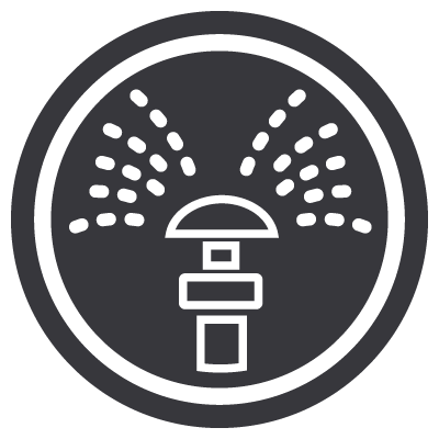 Icon of a sprinkler spraying water in multiple directions, depicted in white on a dark circular background.