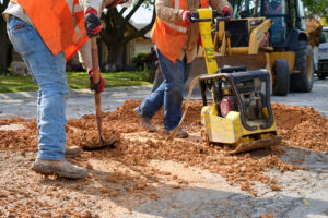Water crews are covering up street holes.